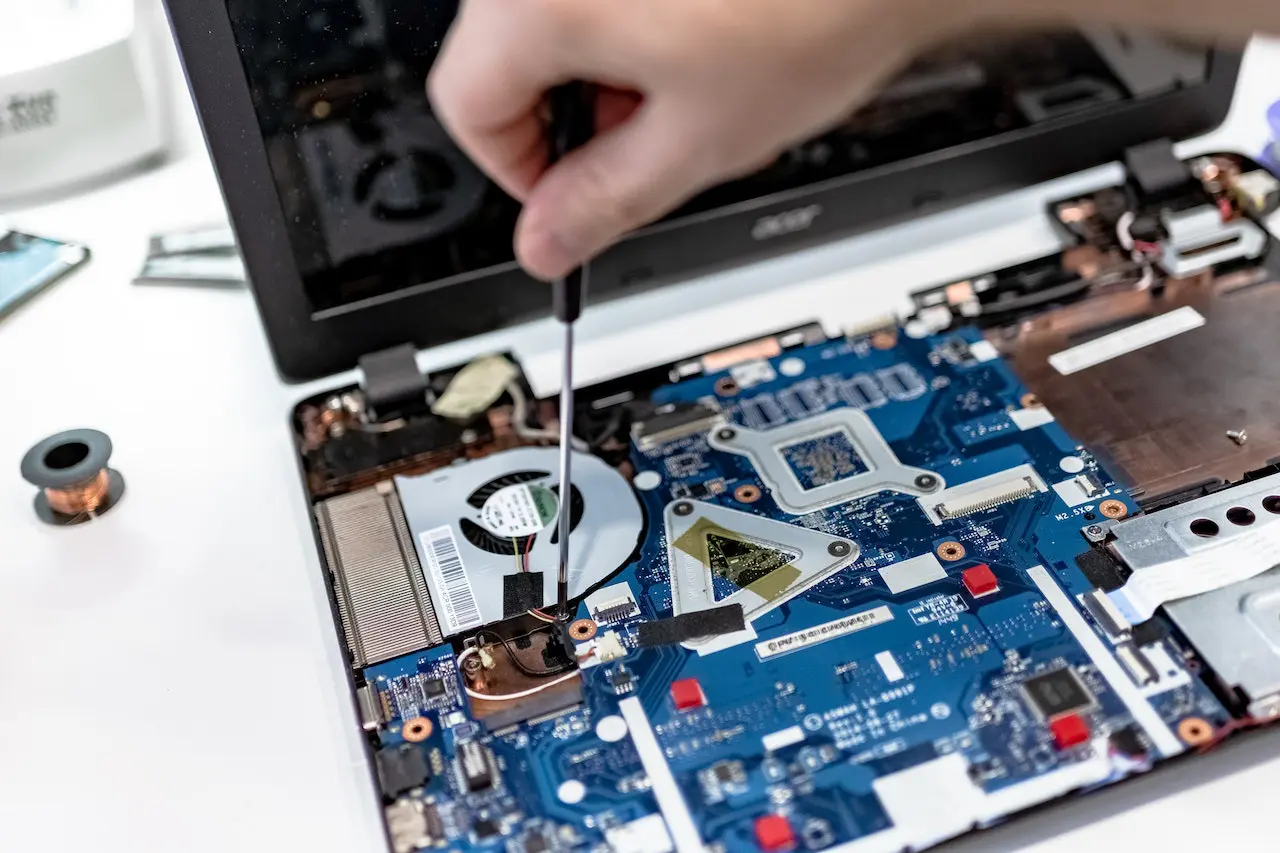 Technician managing business IT equipment